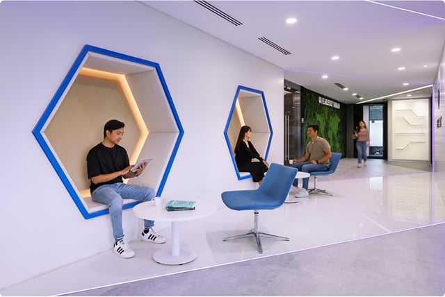 People using phone in a room