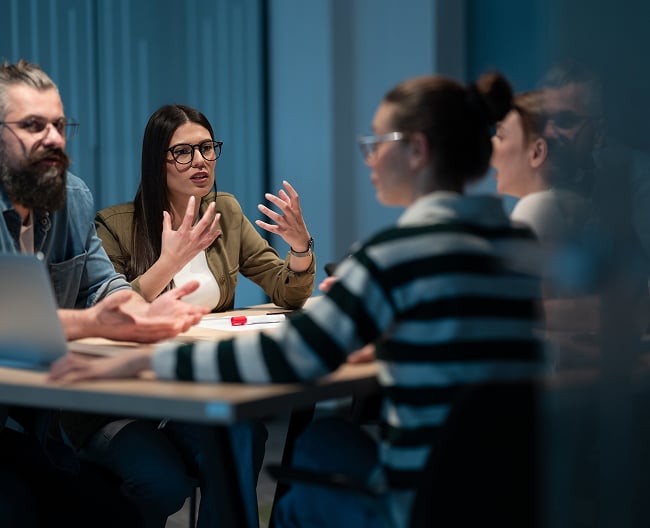 People talking at a table