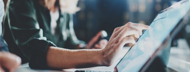 Man typing on touch screen