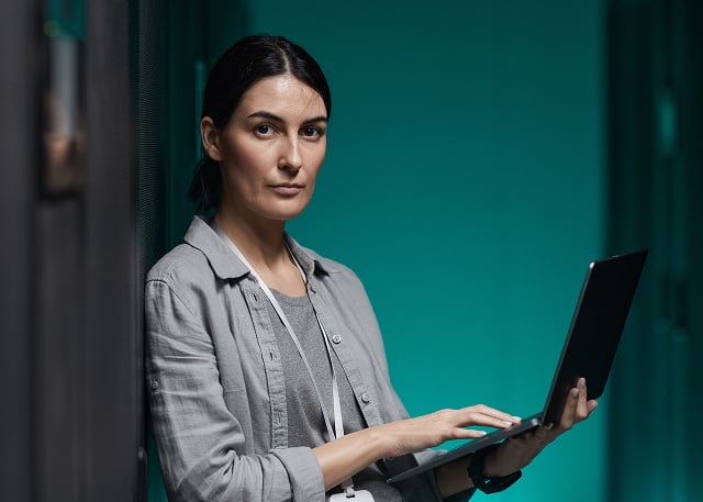 woman holding laptop