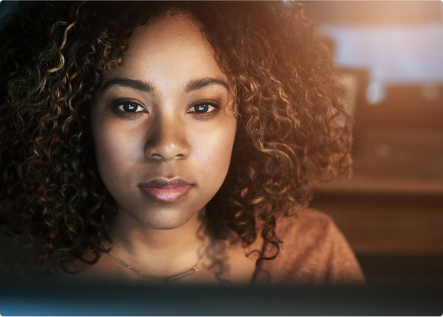 black woman looking at computer